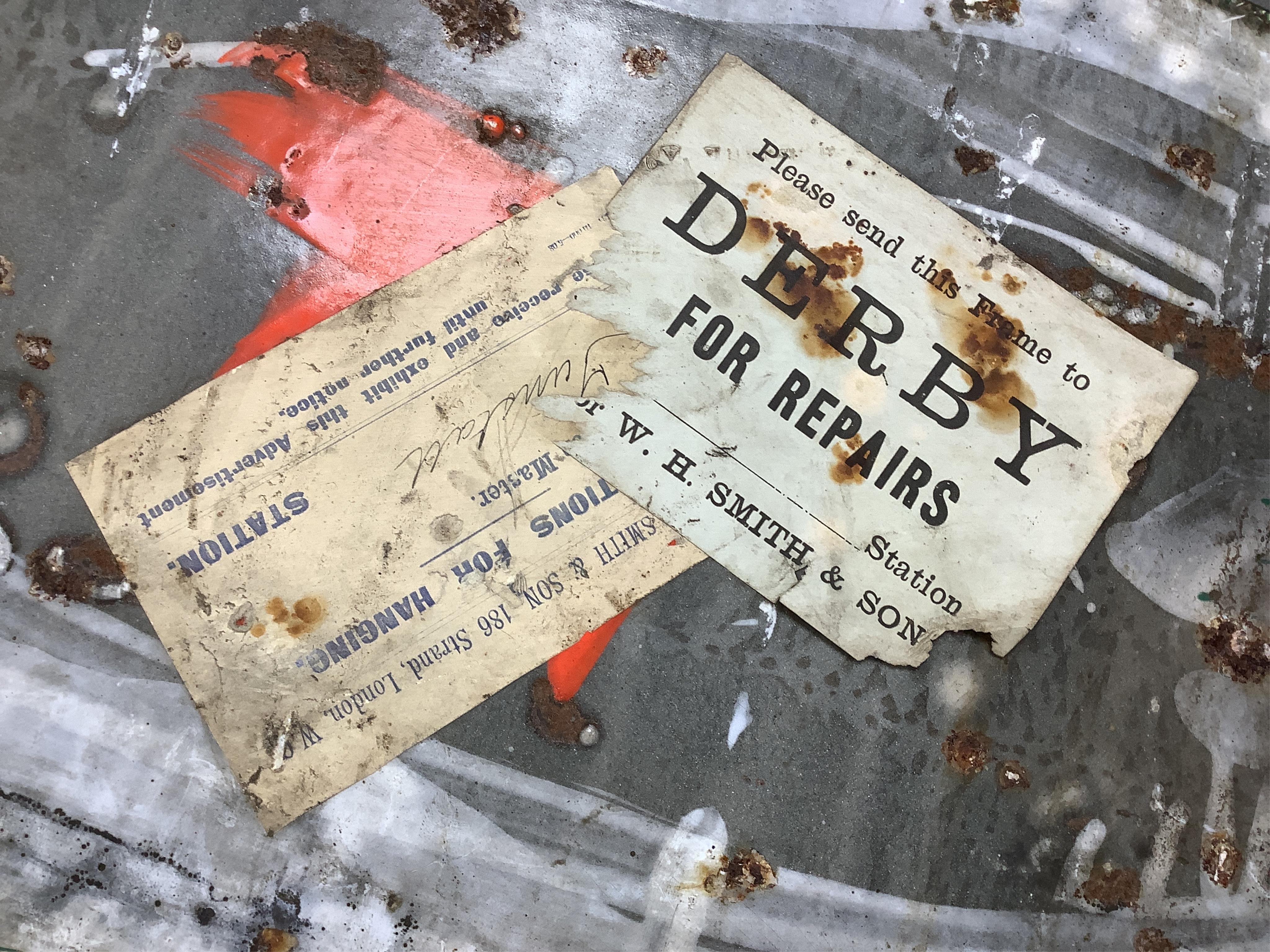 Two Nectar Tea enamel advertising signs, both with original ‘Directions for Hanging’ labels pasted onto the reverse with an allocation for Waterloo Station, one also with a W.H. Smith luggage label for ‘Derby For Repairs